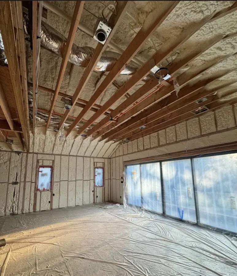 Interior walls and ceiling insulated with spray foam during new construction in Reno